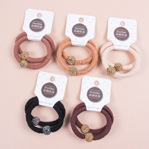 Two milk tea colored rubber bands with thick diamond beads