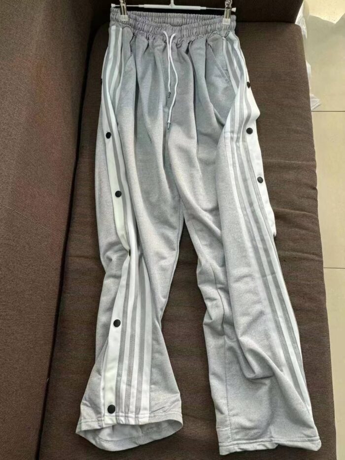 Casual sweatpants for men and women with fully buttoned sides - Tradedubai.ae Wholesale B2B Market