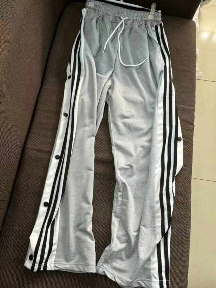 Casual sweatpants for men and women with fully buttoned sides - Tradedubai.ae Wholesale B2B Market