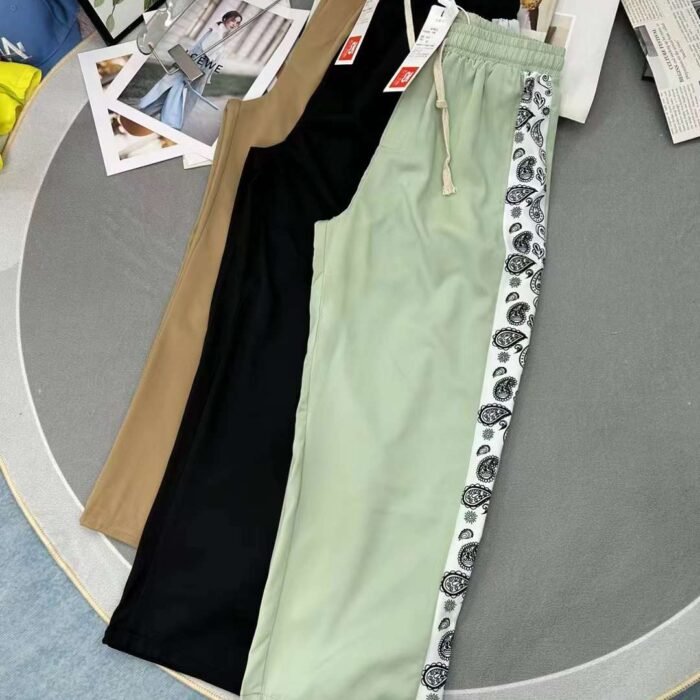Retro sports style casual pants with contrasting drawstrings on the side - Tradedubai.ae Wholesale B2B Market