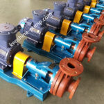 cropped-FS1jpg - Tradedubai.ae Wholesale B2B Market Row of industrial blue centrifugal pumps with gray motors and orange flange connections, mounted on blue bases on a factory floor. - Tradedubai.ae Wholesale B2B Market
